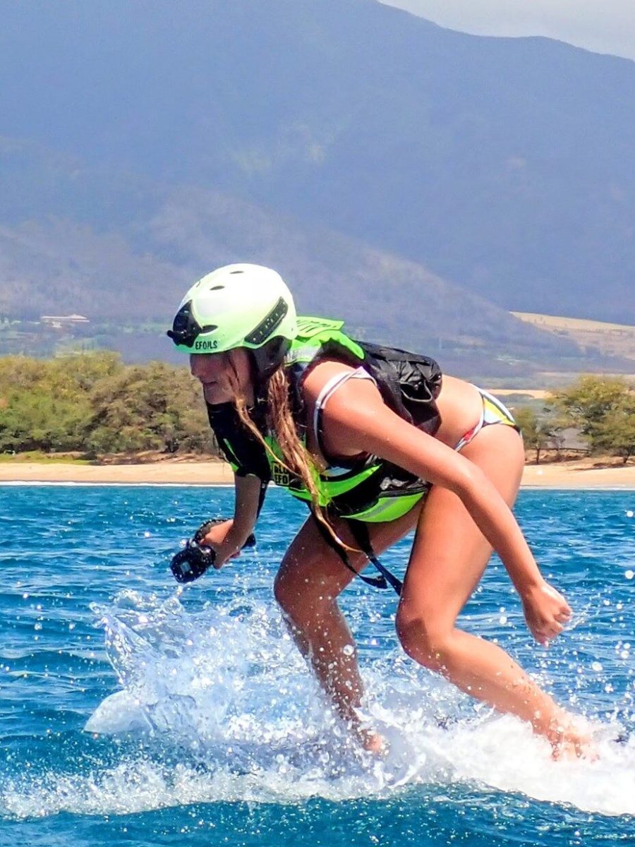 a person riding a surf board on a body of water