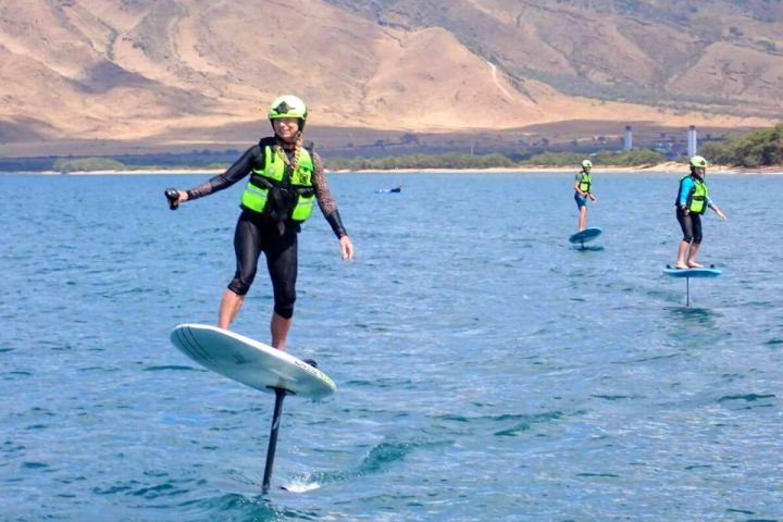 a person riding a surf board on a body of water