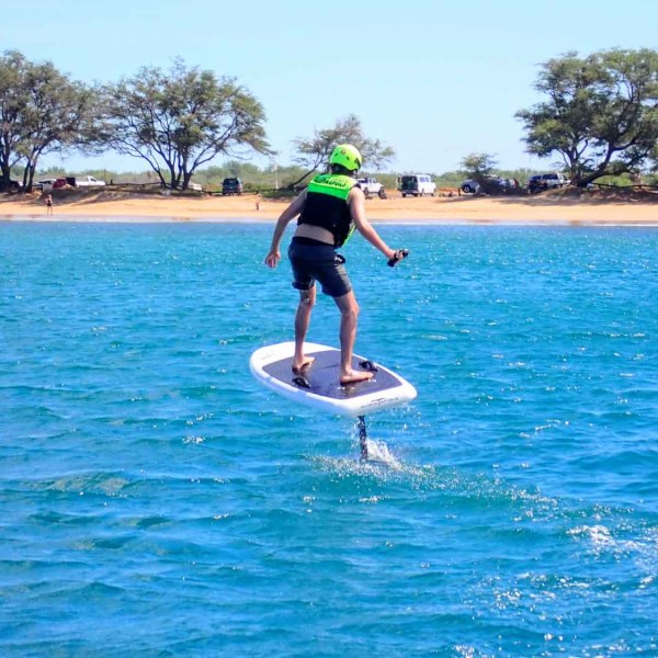 a person riding a surf board on a body of water