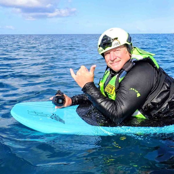 a person riding a surf board on a body of water