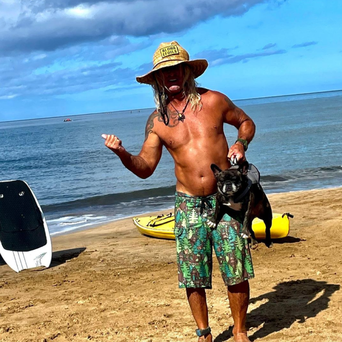 a man standing on top of a sandy beach